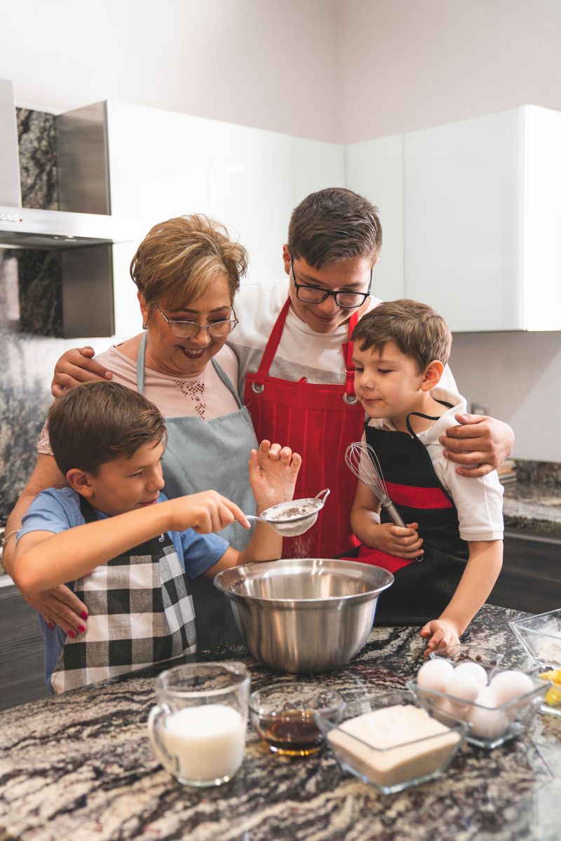 A family reviewing a shopping list on a tablet in a bright kitchen.